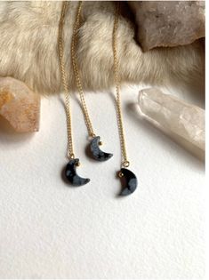 The sweetest little black moon made of snowflake obsidian hung from a delicate 18” gold filled chain. Gold Obsidian Jewelry As A Gift, Handmade Black Celestial Necklace, Black Moon Charm Jewelry For Gift, Celestial Black Necklace For Gift, Black Crescent Necklaces As Gift, Black Crescent Necklaces For Gift, Black 14k Gold Filled Jewelry Gift, Minimalist Black Moon Necklace, Black Moon-shaped Jewelry For Gift