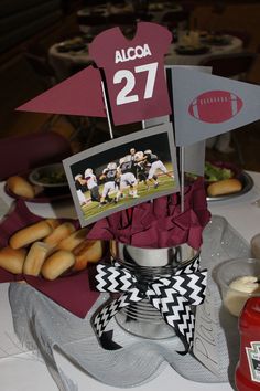 a table topped with food and drinks on top of a white tablecloth covered table