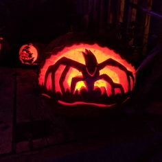 two pumpkins carved to look like they have bats on them