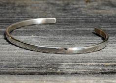 Handcrafted with a focus on dainty yet brilliant, this sterling silver cuff bracelet offers a stunning mirror finish on a half-round surface to play tricks with rays of light and distorted reflections to create a bold statement from delicate and minimalistic bracelet.Based on the same design as one of my best selling rustic bracelets, https://www.etsy.com/listing/83371625/dainty-sterling-silver-cuff-bracelet and perfect for stacking with other bracelets and bangles, this bracelet measures approx Nickel Free Sterling Silver Classic Bangle, Classic Adjustable Sterling Silver Bracelet 925, Classic Adjustable Sterling Silver Bracelet Stamped 925, Minimalist Polished Sterling Silver Bracelet, Classic Sterling Silver Cuff Bangle, Classic Sterling Silver Bangle Stamped 925, Classic Adjustable Sterling Silver Bracelet With Shiny Finish, Nickel-free Classic Cuff Bracelet Gift, Classic Adjustable Bracelet Stamped 925