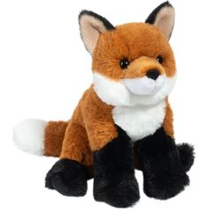 a small stuffed fox sitting on top of a white surface