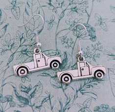 Car wheel earrings, novelty earrings, tyre earrings, mechanic gifts, mechanic earrings, retro earrings, kitsch jewelry, kawaii jewelry, Materials * 18mm silver truck charms  * Sterling silver hooks * light weight * rubber backs for back of earring hooks * length of earrings 2 inches Why not have a go at the LUCKY DIP https://www.etsy.com/listing/1095282417/charm-necklace-jewellery-lucky-dip-charm Add on a PERSONALISED GIFT BOX  https://www.etsy.com/listing/1170103232/add-gift-boxes-to-your We pu Car Jewelry, Truck Driver Gifts, Novelty Earrings, Mechanic Gifts, Driving Instructor, Personalised Gift Boxes, Kawaii Jewelry, Retro Earring, Jewelry Card