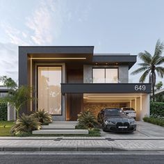 two cars are parked in front of a modern house with palm trees and landscaping around it