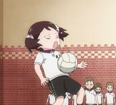 a girl is playing volleyball in front of other girls and one boy stands behind her