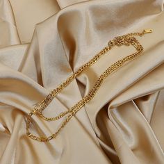 This Layered Gold Figaro Necklace, with its 18k gold-filled layers, brings a sophisticated flair. Its classic Figaro chain design offers timeless elegance, perfect for enhancing both everyday and formal ensembles. Classic Gold Metal Chain Necklace, Double Strand Gold Plated Figaro Chain Necklace, Gold Plated Double Strand Figaro Chain Necklace, Metal Figaro Chain Necklace For Layering, Elegant Double Chain Link Layered Necklace, Elegant Gold Chain Link Necklace, Formal Gold-plated Figaro Chain Necklace, Elegant Gold-tone Layered Metal Necklace, Gold Double Strand Figaro Chain Necklace