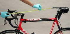 a close up of a person holding a bike with a tape on the handlebars