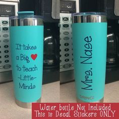 two blue tumblers with words on them sitting next to each other in front of microwaves