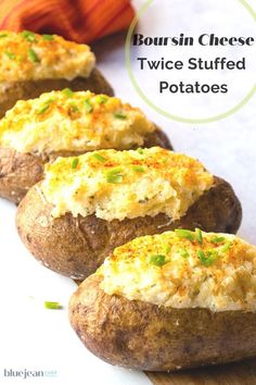 three baked potatoes sitting on top of a cutting board