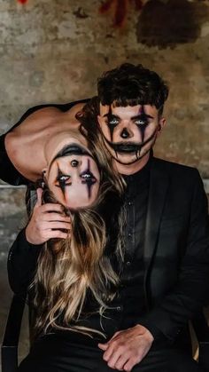 a man and woman with makeup on their faces