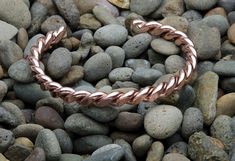 "*Please measure your wrist for accurate sizing before ordering.* This is a solid twisted copper bracelet that works great for both men and women. It is welded on the ends with sterling silver. The bracelet is 1/4 of an inch (0.6 cm) wide and close to a 1/4 inch thick. I cut, shape, hammer, and finish each bracelet by hand. This is a stock photo and I hand make each bracelet so the one you receive may look slightly different than the photo. Please check our listing for a thicker copper bracelet Mens Copper Bracelet, Handmade Copper Bracelet, Hammered Cuff Bracelet, Copper Diy, Copper Cuff Bracelet, 7th Anniversary, Copper Cuff, Metal Chain Link, Copper Bracelet