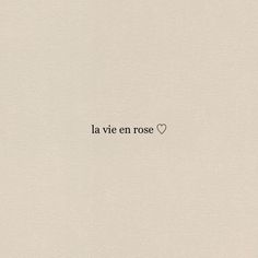 the word la vie en rose written in black ink on a white paper with a heart