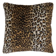 a leopard print pillow on a white background