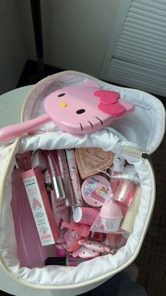 a hello kitty bag filled with cosmetics and other items