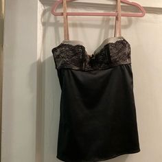 This Is A Stunning Dolce & Gabbana, Lace And Satin/Elastin Bustier Camisole. It Is Piped With Gross Grain Ribbon It Has A Built-In Bra Only For An Extra Small Individual. It Has A Gross Grain. Tiny Flat Bow With The D & G Gold Plate Insignia.Tthe Straps Are Nude Colored, And Have Gabbana Embroidered Into Them. The Back Has An Adjustable Three Hook Bra The Bra Is Silver With Black Lace Overlay. The Bodice Is Black Satin/Elastin Mint Condition. Party Camisole With Sweetheart Neckline And Built-in Bra, Strapless Evening Tank Top With Built-in Bra, Fitted Camisole With Built-in Bra For Evening, Elegant Corset With Delicate Straps, Strapless Tops With Lace Trim For Party, Strapless Tops With Lace Trim For Night Out, Elegant Corset With Lace Trim And Spaghetti Straps, Elegant Lace Trim Corset For Night Out, Party Camisole Corset With Lace Trim