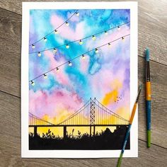 a watercolor painting of the golden gate bridge in san francisco, california at sunset