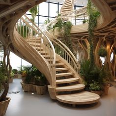 a spiral staircase in the middle of a room with potted plants on either side