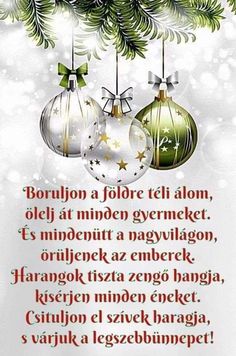 a christmas card with three ornaments hanging from the tree and words written in russian on it