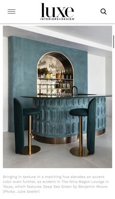 the front page of luxury interior design magazine, with an image of a bar and two stool