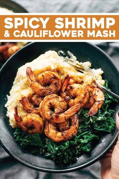 a bowl filled with mashed cauliflower and shrimp on top of spinach