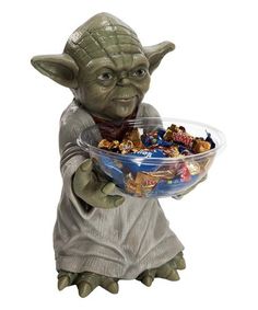 a star wars yoda holding a bowl of candy