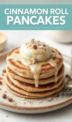 cinnamon roll pancakes on a plate with icing drizzled over the top