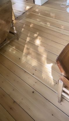 a wooden floor with a chair on it