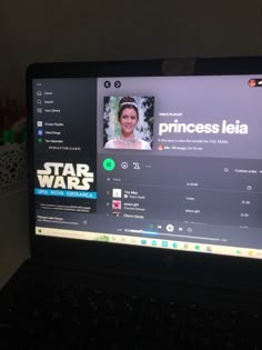 an open laptop computer with princess leia on the screen and star wars stickers