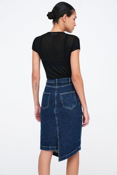 Let your style play by its own rules with our LES Denim Skirt. This striking pencil skirt's asymmetrical hem winds around and meets at an eye-catching right angle in both the front and back. Complete with five pockets, LES is as sharp and individual as the women who wear her. [SPLIT] Astrid is 5'9" (175 cm) tall, wearing size 25. Total length from below the waist is approximately 22.5" (57.5 cm). European Denim (100% Cotton). Turn inside out for better washing results. Machine wash on delicate c Edgy Fitted Dark Wash Denim Skirt, Edgy High Rise Fitted Denim Skirt, Edgy Fitted Dark Wash Skirt, Fitted Denim Pencil Skirt For Summer, Fitted Dark Wash Asymmetrical Denim Skirt, Fitted Asymmetrical Denim Skirt In Dark Wash, Fitted Dark Wash Asymmetrical Skirt, Fitted Asymmetrical Dark Wash Denim Skirt, Fitted Asymmetrical Dark Wash Skirt