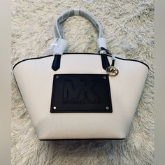 Cream And Black Large Michael Kors Purse. Brand New With Tags. Perfect For Summer Or The Beach. Approximately 11” Base, 21” Top Width And 12.5” Tall Michael Kors Beige Bags With Leather Trim, Chic White Bags With Leather Trim, Michael Kors Cream Bag For Shopping, Michael Kors Tote Bag With Leather Trim, Michael Kors Leather Trim Tote Bag, White Bags With Leather Trim For Shopping, Michael Kors Cream Bag For Daily Use, Michael Kors Cream Shoulder Bag For Daily Use, Michael Kors Canvas Tote Bag