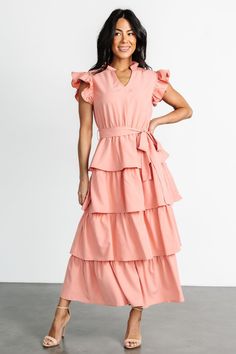 Chrysanthi Tiered Dress | Dusty Coral Feminine Belted Maxi Dress, Feminine Maxi Dress With Tie Waist, Chic Pink Maxi Dress With Ruffle Hem, Pink Maxi Dress With Ruffle Hem, Elegant Pink Belted Maxi Dress, Feminine Maxi Dress With Ruffle Sleeves, Feminine Tie Waist Maxi Dress For Brunch, Feminine Maxi Dress With Tie Waist For Brunch, Chic Maxi Dress With Flutter Sleeves And Tie Waist