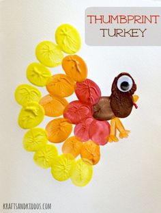 a turkey made out of orange, yellow and red leaves with the words thumpprint turkey on it