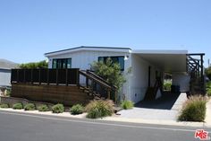 a mobile home with stairs leading up to it