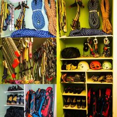 there are many pairs of shoes and helmets in this closet, all lined up on shelves