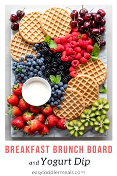 waffles, berries, and kiwis are arranged on a platter