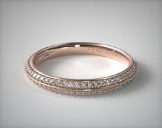 a rose gold wedding band with rows of diamonds