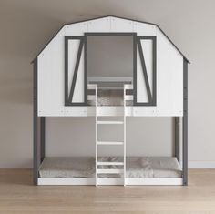 there is a bunk bed with a ladder to the top and bottom level that has a loft above it