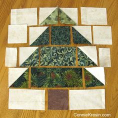 a quilted christmas tree made out of squares