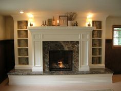 a living room with a fire place and bookcases