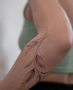 a woman with a tattoo on her arm