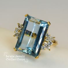 Thank you for coming in! Pretty large aquamarine 18k yellow gold Diamond vintage ring! Marquise and round diamonds are set into each side totaling 1 carats! Ring Size: 6.5 Total Weight: 11.1 grams Precious Metal: 18k yellow gold Precious stones: -Aquamarine Center Stone: 16.2 carats, 19.5mmx13.5mm -White Round Diamonds: 1ct, Marquise x4, Round x6 Hallmark: 18k Aquamarine Brilliant Cut Diamond Ring For Formal Occasions, Formal Aquamarine Diamond Ring With Brilliant Cut, Luxury Aquamarine Diamond Ring With Prong Setting, Formal Aquamarine Diamond Ring With Prong Setting, Formal Light Blue Aquamarine Diamond Ring, Elegant Aquamarine Diamond Ring With Prong Setting, Elegant Emerald Cut Topaz Ring With 17 Jewels, Luxury Light Blue Brilliant Cut Topaz Ring, Elegant Emerald Cut Topaz Ring