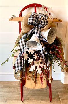 a wooden chair with a christmas decoration on it