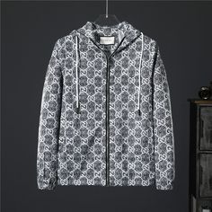 Embrace iconic style with this GG Monogram Windbreaker, channeling the essence of Gucci's luxurious aesthetic. The all-over monogram print in a sleek black and white colorway exudes sophistication, while the hooded design and zip closure offer practicality and versatility. Crafted with attention to detail, this windbreaker is a statement piece that effortlessly elevates any casual ensemble. Designer Streetwear Outerwear With Logo Print, Designer Outerwear With Logo Print, Designer Logo Print Winter Outerwear, Designer Winter Outerwear With Logo Print, Designer Black Outerwear With Logo Print, Luxury Monogram Printed Outerwear For Winter, Luxury Monogram Print Outerwear For Winter, Luxury Winter Outerwear With Monogram Print, Luxury Monogram Print Winter Outerwear