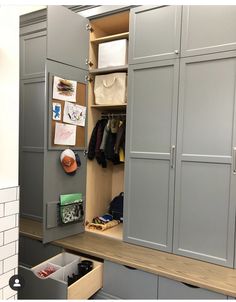 an organized closet with drawers and hanging items