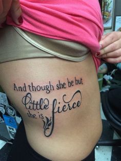 a woman with a tattoo on her stomach that says and though she be but little, she is fierce