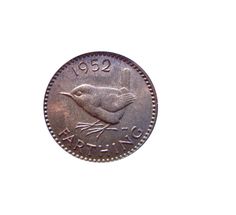 an old coin with a small bird on the front and bottom, is shown against a white background