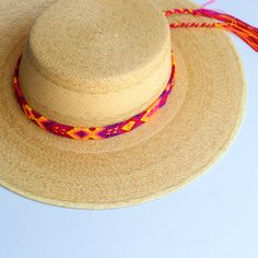 These Beautiful hat bands are carefully hand woven by Rosa in Chiapas,Mexico. Each band showcases a unique and colorful patterned design using traditional macrame techniques. Add a touch of handmade artistry to your hat collection today! Width 1” Length: 23 inches, not including fringe Fringe 9” each side , for an adjustable fit. Fits most hats Polyester yarn All items are shipped from US. All Mi Mundo Mexicano items are 100% handmade by artisans in Mexico. Each stitch and item is completely uni Adjustable Flat Brim Handwoven Panama Hat, Adjustable Handwoven Panama Hat With Flat Brim, Adjustable Handwoven Straw Hat With Flat Brim, Natural Toquilla Straw Hat Bands For Festivals, Adjustable Woven Hat With Flat Crown, Adjustable Handwoven Flat Brim Panama Hat, Festival Toquilla Straw Hat Bands, Multicolor Woven Hats With Flat Brim, Adjustable Multicolor Toquilla Straw Sun Hat