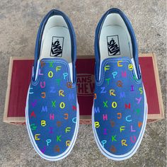 These colorful alphabet chalk board Slip On Vans are the perfect gift for Teacher Appreciation Week, thanking your favorite daycare worker, or the hard working educator in your life! We buy each pair of shoes BRAND NEW. Each pair is made to order, please make sure you put in the correct shoe size before you check out. The ink is permanent and will never come off, fade away, or peel off. Made in the USA. This price includes everything: shoes, artwork, and shipping. Thanks for stopping by our Etsy Teacher Shoes Painted, Shoes Artwork, Daycare Worker, Teacher Shoes, Colorful Alphabet, Painted Canvas Shoes, Teacher Day, Cute Letter, Custom Painted Shoes