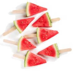 watermelon popsicles with toothpicks on white background, top view photo