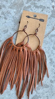 Brown Tassel Earrings For Festivals, Adjustable Brown Bohemian Tassel Earrings, Bohemian Brown Fringe Earrings, Brown Fringe Tassel Earrings For Festivals, Brown Fringe Dangle Jewelry, Artisan Brown Jewelry With Tassels, Brown Fringe Tassel Dangle Earrings, Brown Fringe Dangle Tassel Earrings, Brown Dangle Tassel Earrings With Fringe