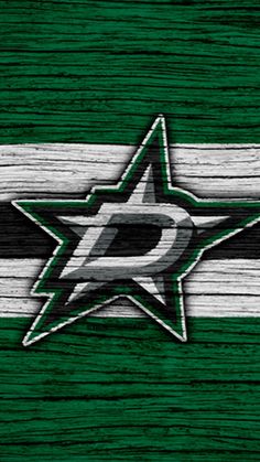 the hockey team's logo is painted on wooden planks with green and white stripes